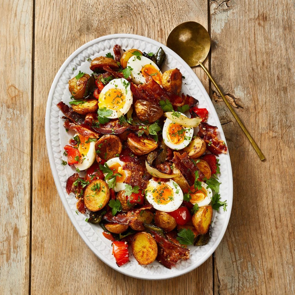 roasted potatoes and jammy eggs on a white plate