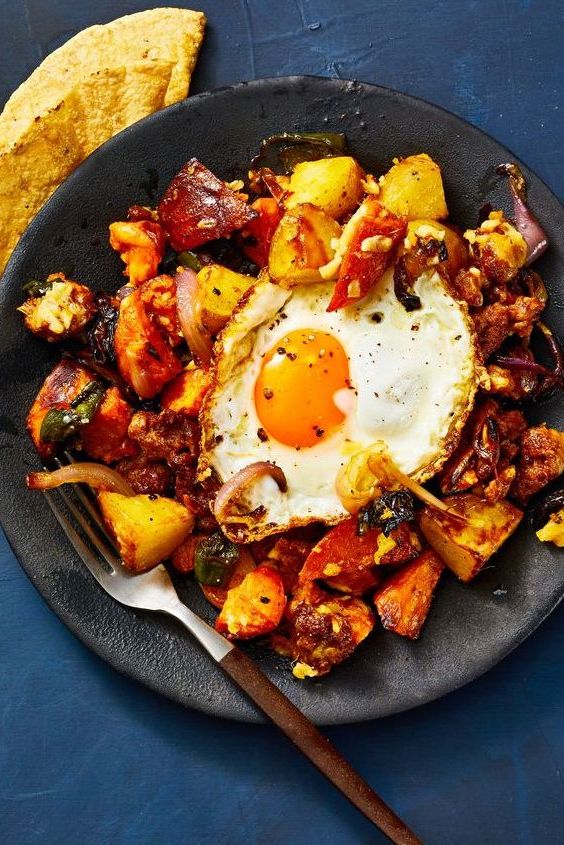 roasted potato and chorizo hash with a fried egg on top