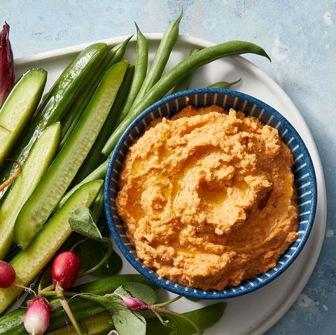 roasted red pepper hummus in a blue bowl