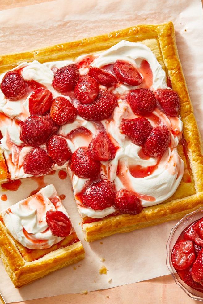 strawberry tart with whipped cream on puff pastry