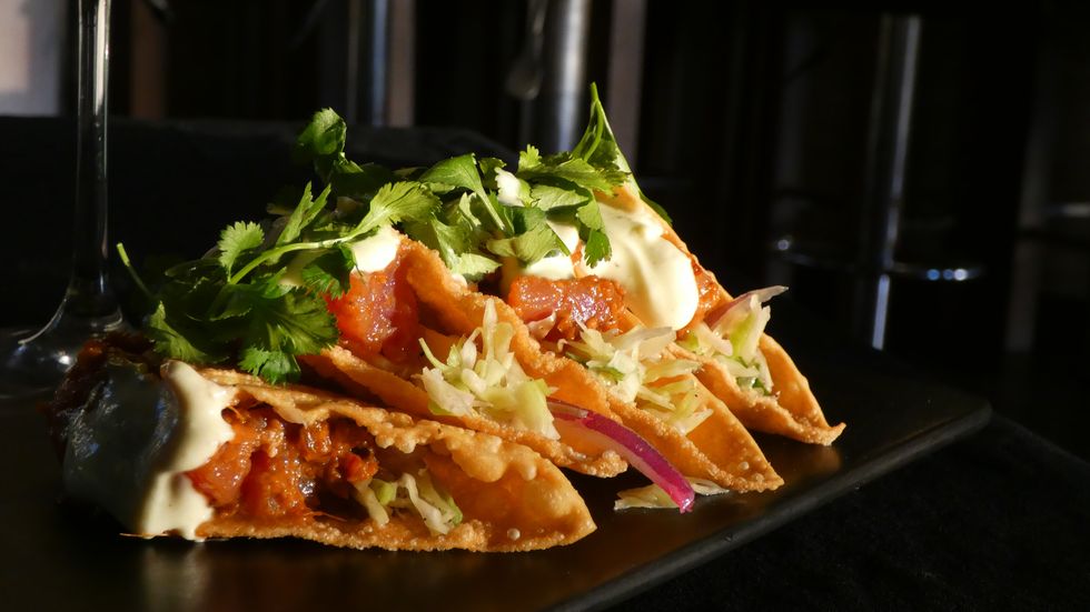 a plate of spicy tuna wonton tacos