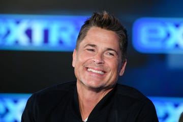 rob lowe smiles while visiting extra at burbank studios