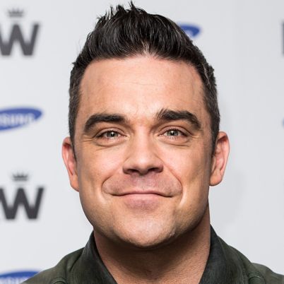LONDON, ENGLAND - NOVEMBER 26: Robbie Williams attends a photocall to announce a forthcoming stadium tour for Summer 2013 in conjunction with Samsung at Soho Hotel on November 26, 2012 in London, England. Olly Murs is scheduled as special guest on all dates which are presented in association with Samsung. (Photo by Ian Gavan/Getty Images)