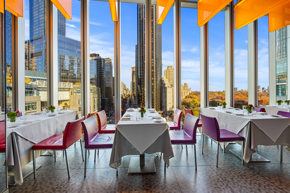 a room with tables and chairs