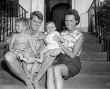 robert and ethel kennedy with their children on steps