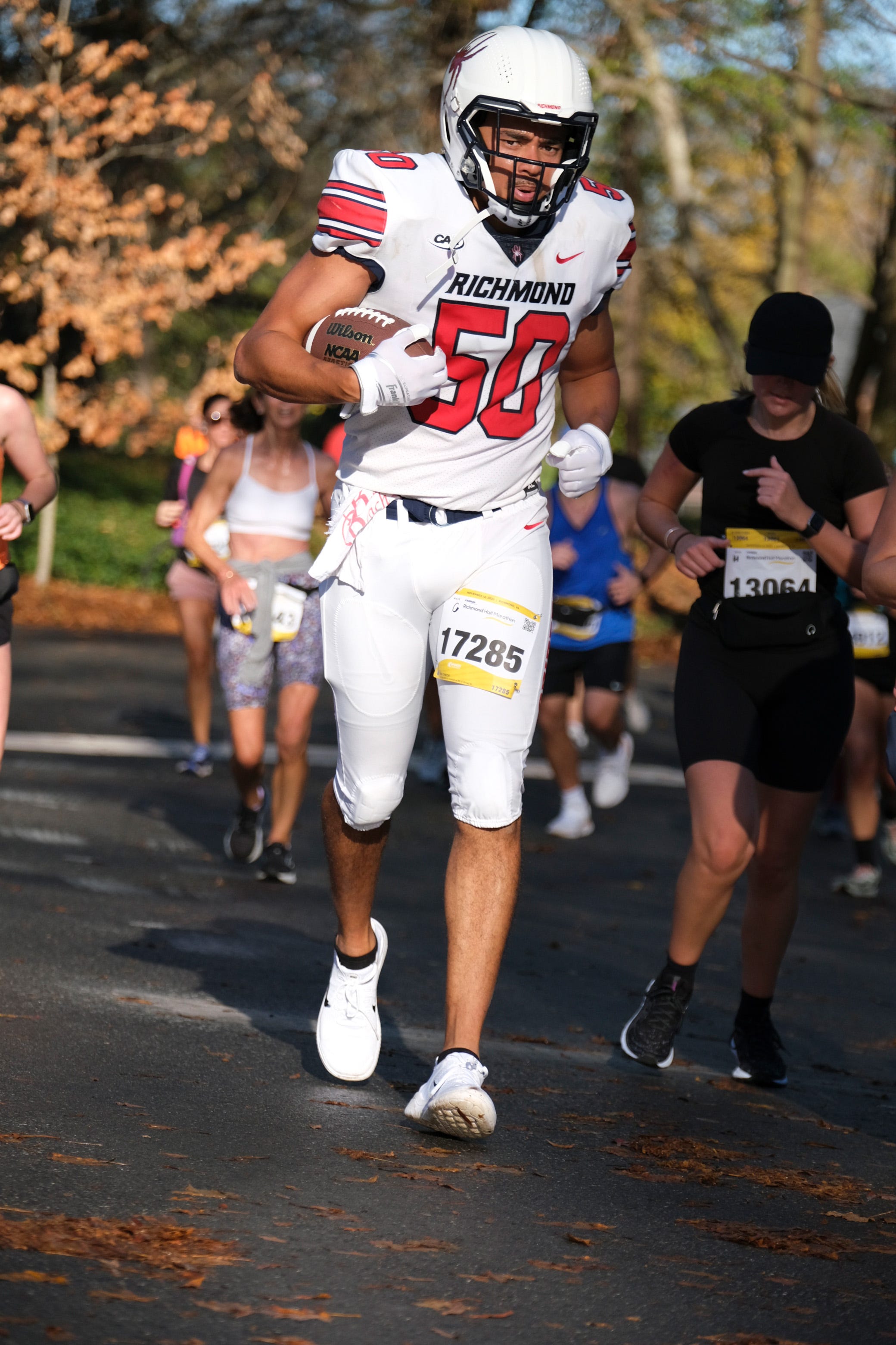 Former Track Athlete Runs Half Marathon in Full Football Uniform