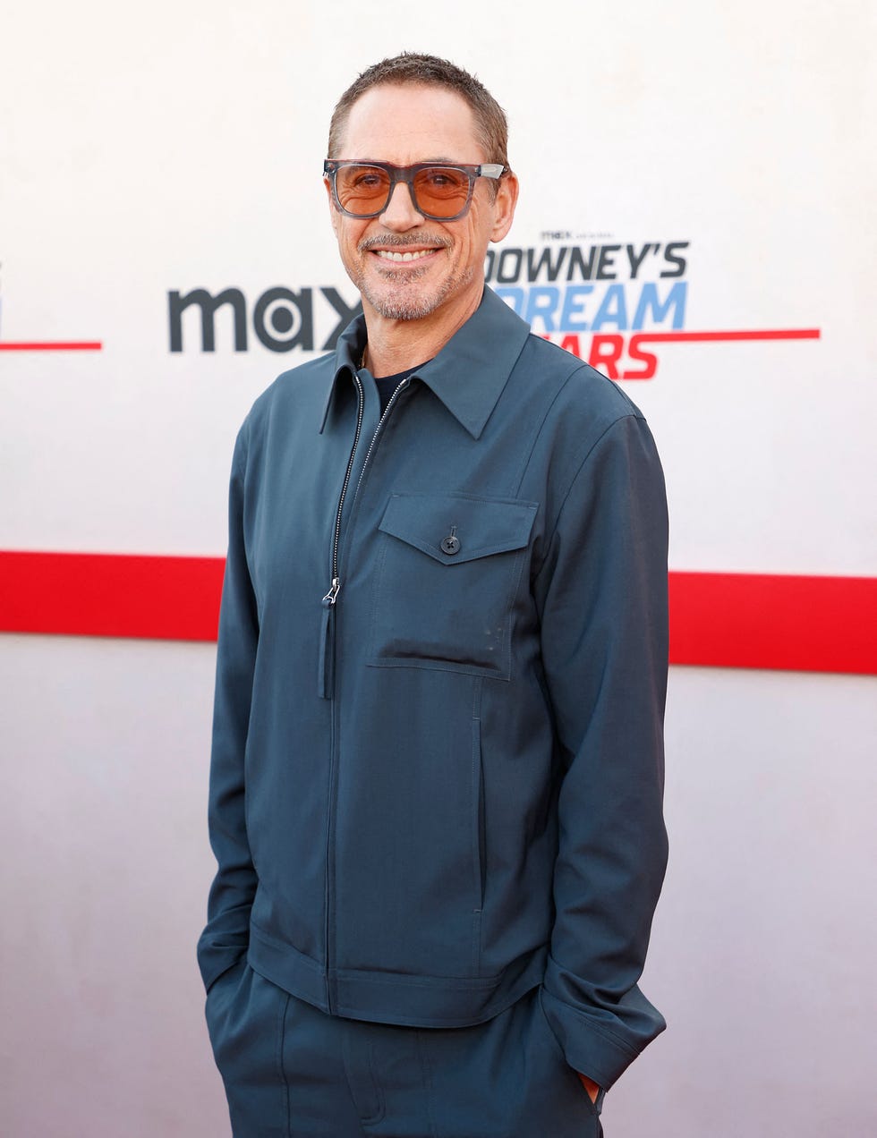 robert downey jr arrives for downeys dream cars screening wearing navy and sunglasses