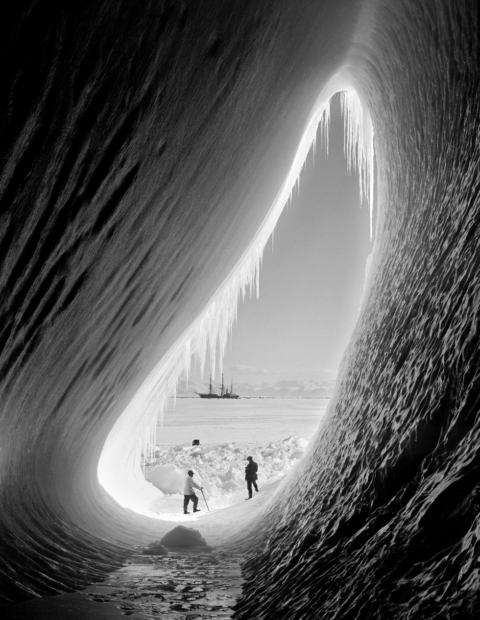 geologist thomas griffith taylor 1880 1963 and meteorologist charles wright 1887 1975 in the entrance to an ice grotto during captain robert falcon scotts terra nova expedition to the antarctic, 5th january 1911 the terra nova is in the background photo by herbert pontingscott polar research institute, university of cambridgegetty images