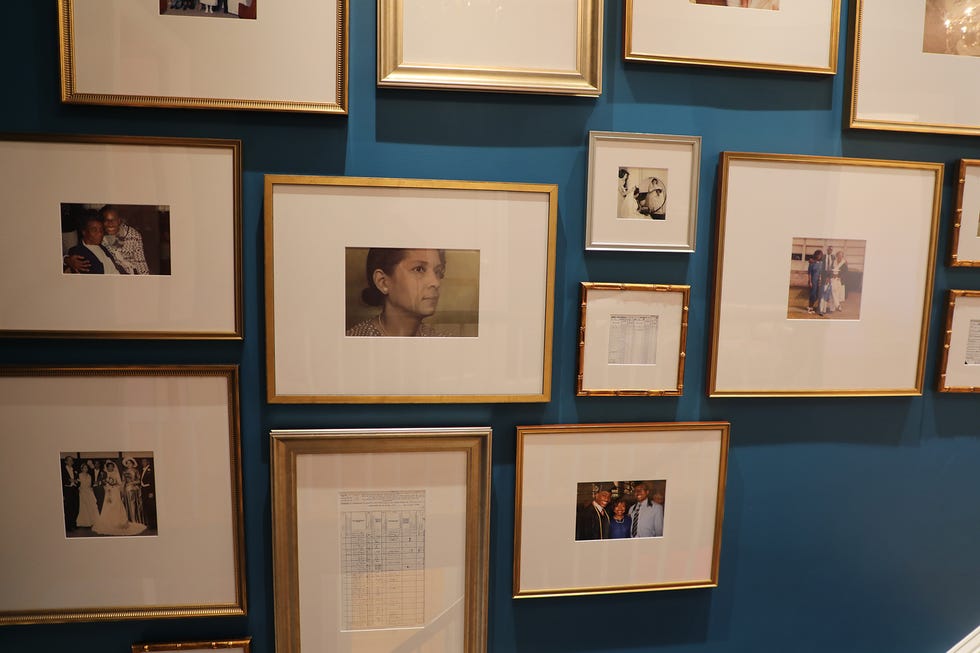 family photos and a framed census document in the stairhall.