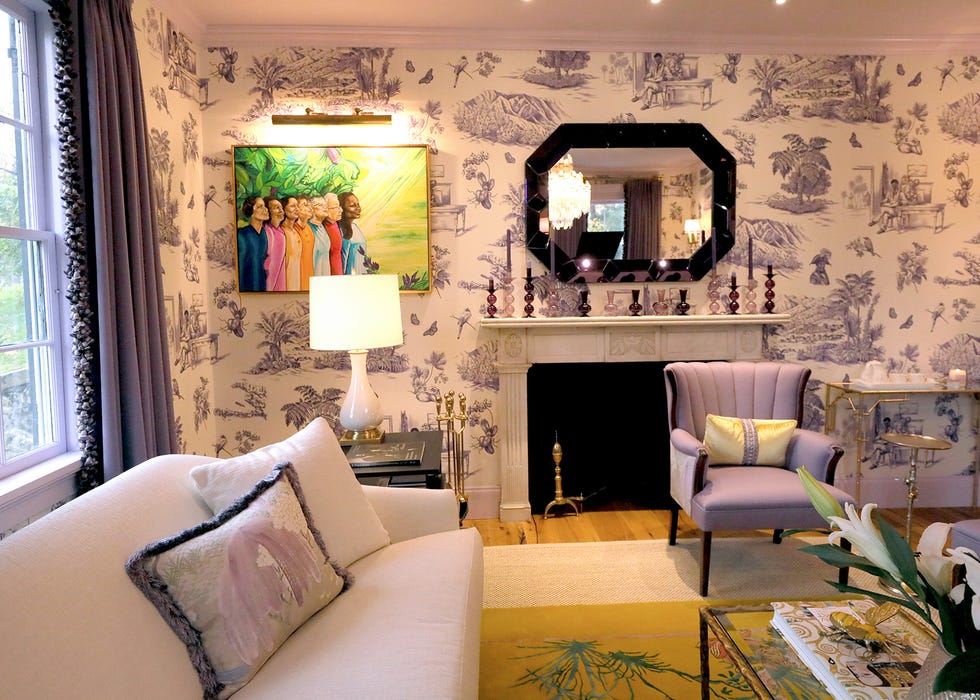 hartwell named his living room "paulette's parlor" after his late aunt. the walls are covered in toussaint toile, a schumacher print by victor glemaud with scenes depicting toussaint louverture, a leader of the haitian revolution.
