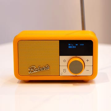 compact yellow roberts revival petite 2 radio with digital display and control buttons