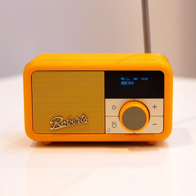 compact yellow roberts revival petite 2 radio with digital display and control buttons
