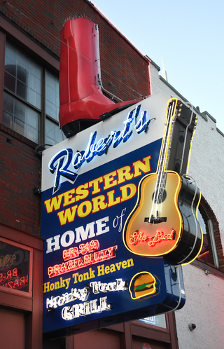 a neon sign outside robert's western world in nashville