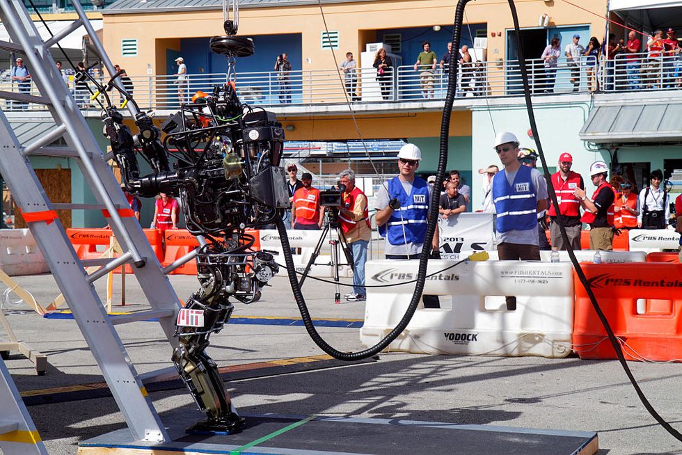 A robot on a climbing ladder task at the DARPA Robotics Challenge Trials.