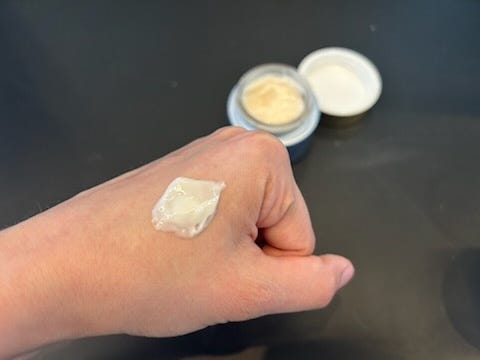 a photo of a lab scientist testing a roc neck firming cream in the good housekeeping instititute
