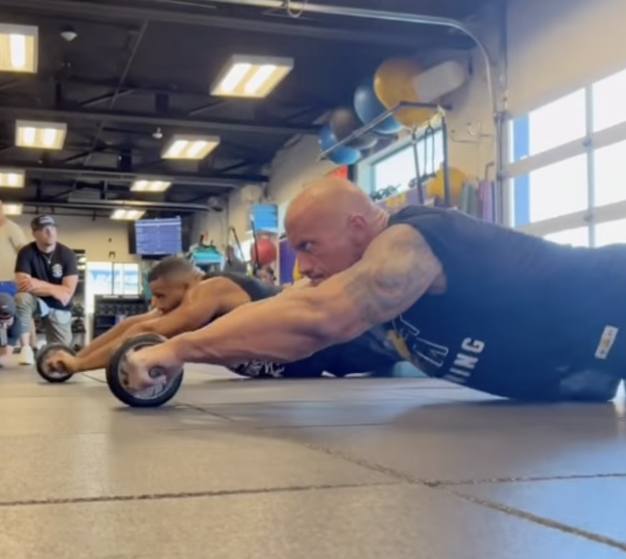 The Rock tries on Aaron Donald's Super Bowl ring during insane workout as  ex-wrestler says NFL star is 'living my dream'