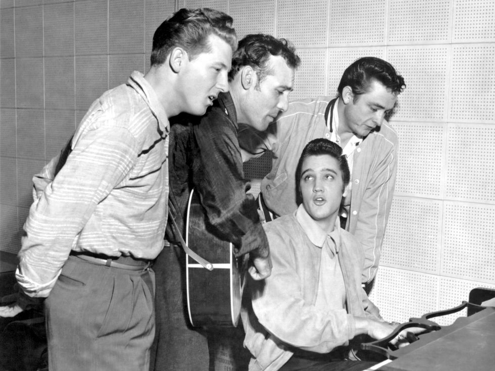 rock and roll musicians jerry lee lewis, carl perkins, elvis presley and johnny cash as "the million dollar quartet"