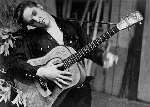 Elvis Presley portrait with an acoustic guitar