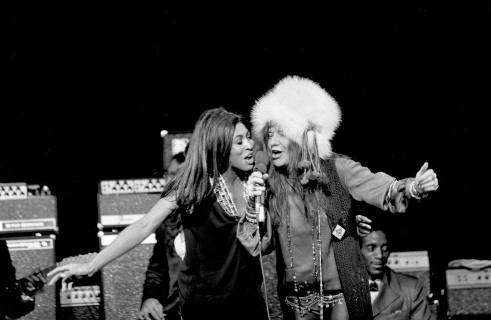 tina turner and janis joplin sing into the same microphone that joplin holds
