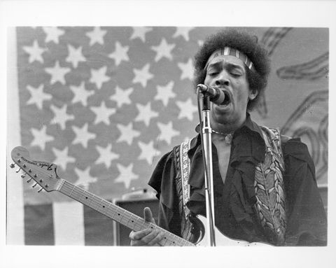 Jimi In Front Of An American Flag