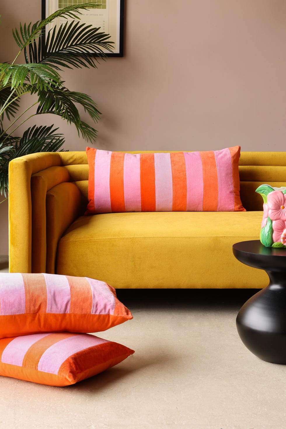 rockett st george, orange pink velvet rectangular cushion wes anderson style interiors pastel colourful retro yellow sofa bright cushions living room