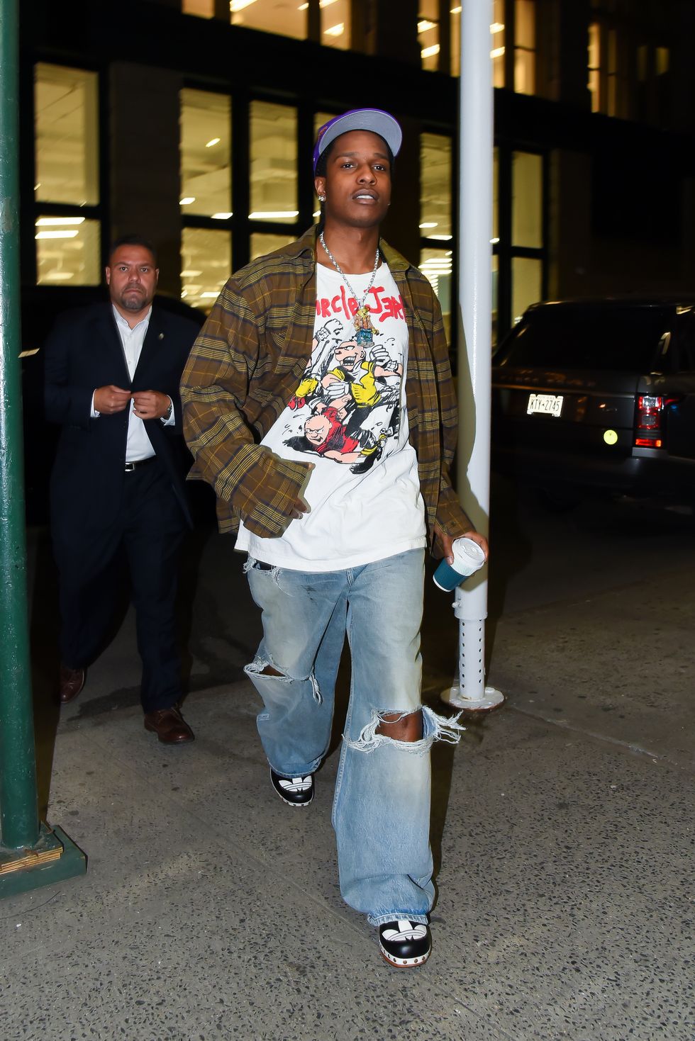 Rihanna Steps Out With A$AP Wearing Mini Skirt and Dramatic Thigh High Boots