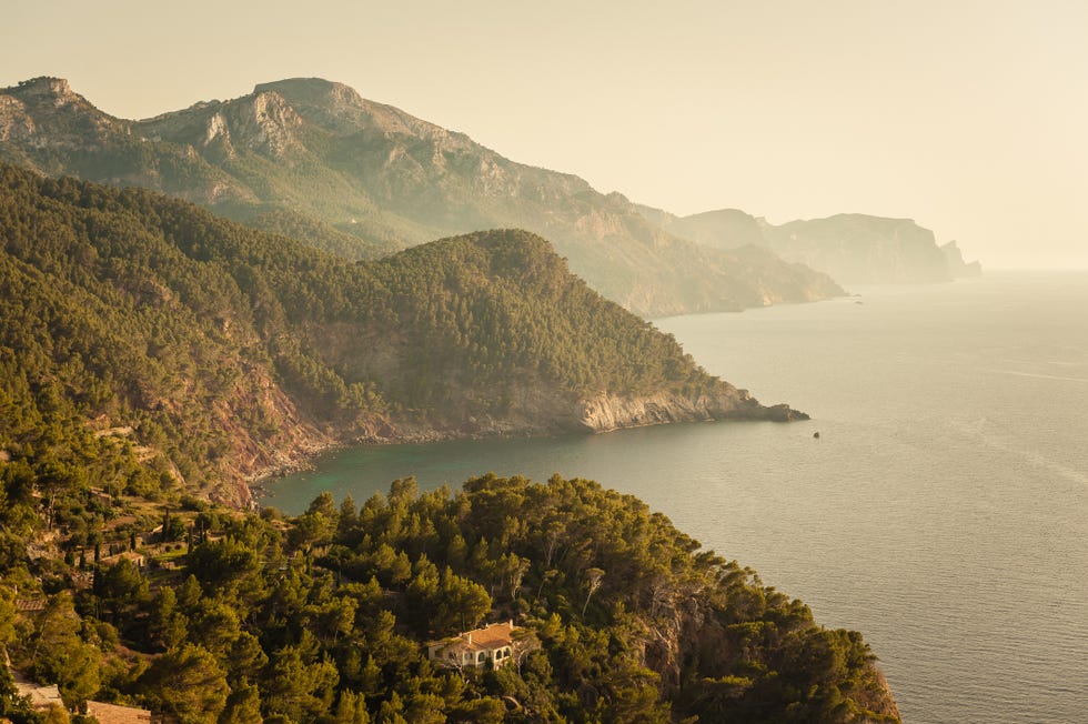 rocky mountains along coastline in fog, serra de tramuntana, mallorca, balearic islands, spain