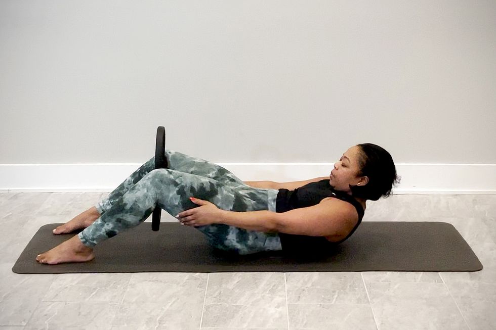 pilates ring exercises, seated roll back
