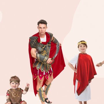 women, baby, man, kid dressed in roman empire halloween costumes