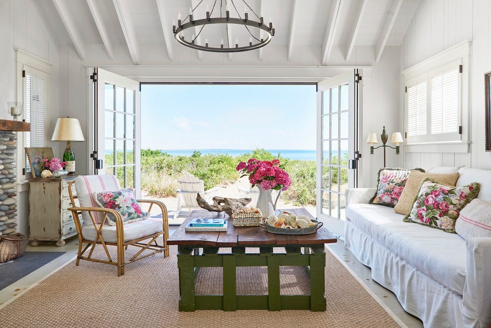 beach cottage living room with rose patterned pillows