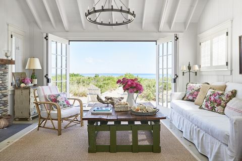 beach cottage living room with rose patterned pillows