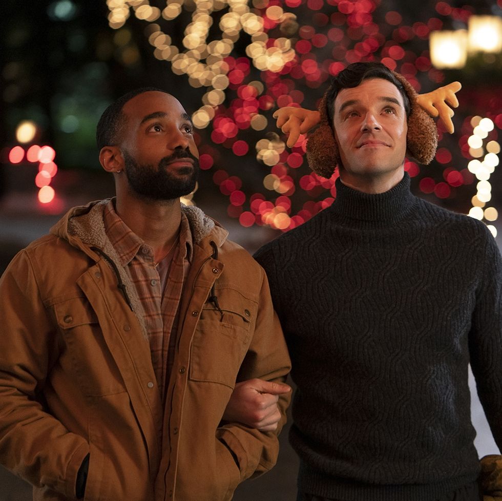 philemon chambers as nick and michael urie as peter in a scene from single all the way, a good housekeeping pick for best romantic christmas movies