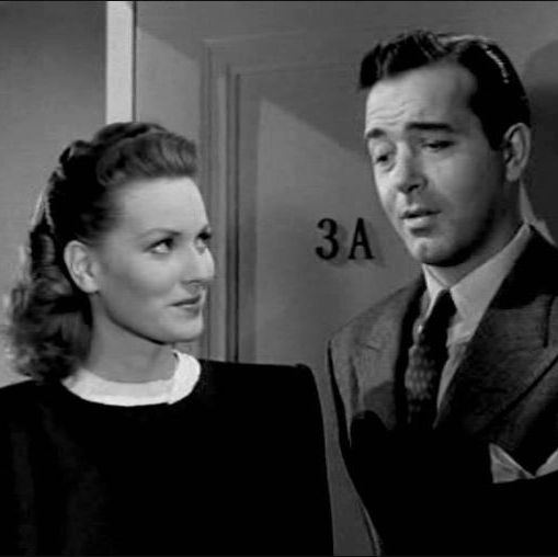 doris gives fred a knowing glance in a scene from miracle on 34th street