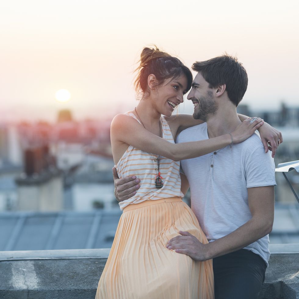 romantic couple on rooftop, paris