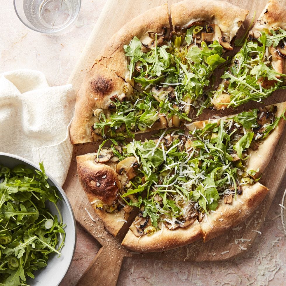 romantic dinner mushroom and arugula salad pizza