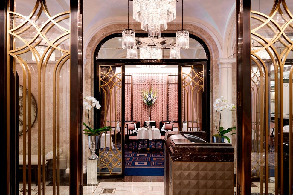 a look through the hall at the pink and blue dining room