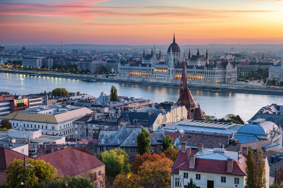 romantic sunrise over budapest landmarks and danube river