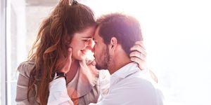 romantic young couple face to face in office