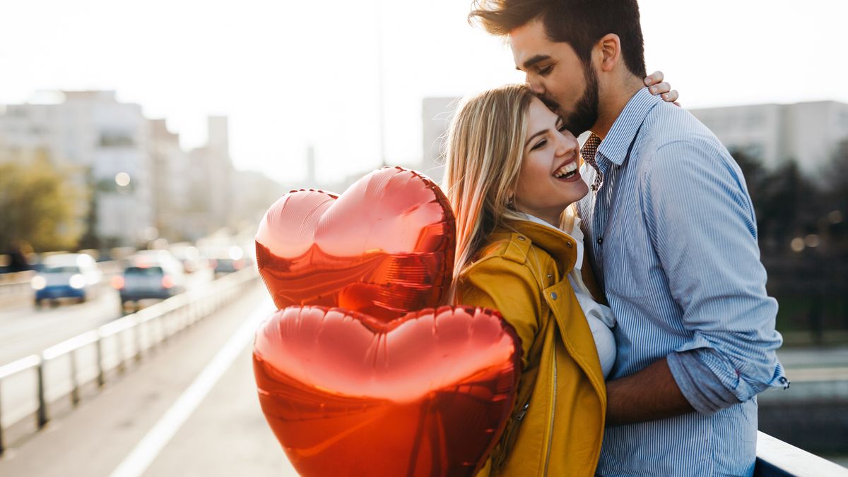 romantic young couple in love, hugging on the street
