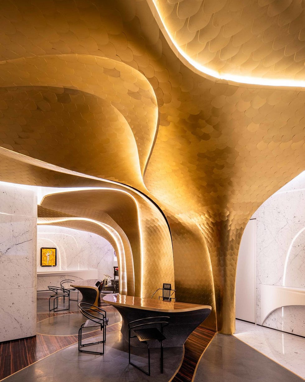 modern interior space featuring golden textured arches and sleek furniture modern interior space featuring golden textured arches and sleek furniture