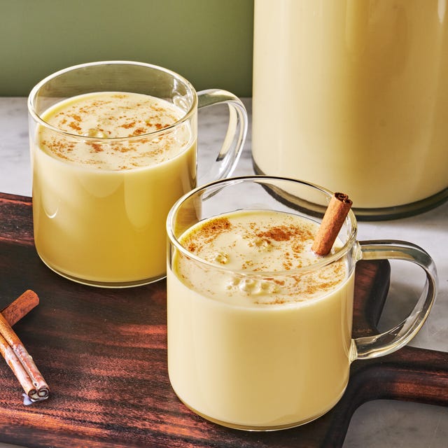 Rompope creamy rompope in clear mugs with cinnamon sticks