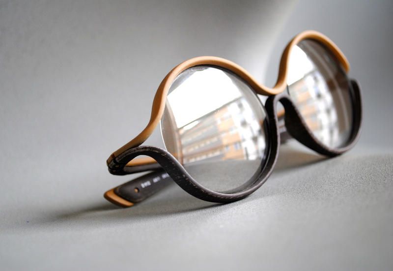 Eyewear, Glasses, Vision care, Product, Brown, Glass, Photograph, Tints and shades, Amber, Reflection, 