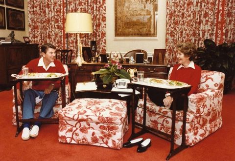 ronald and nancy reagan enjoying a meal on silver tv trays in the white house