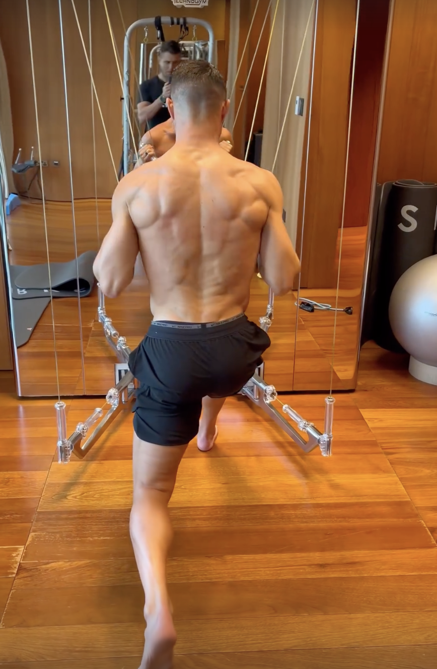 Cristiano Ronaldo shows off his bulky biceps as he works out in