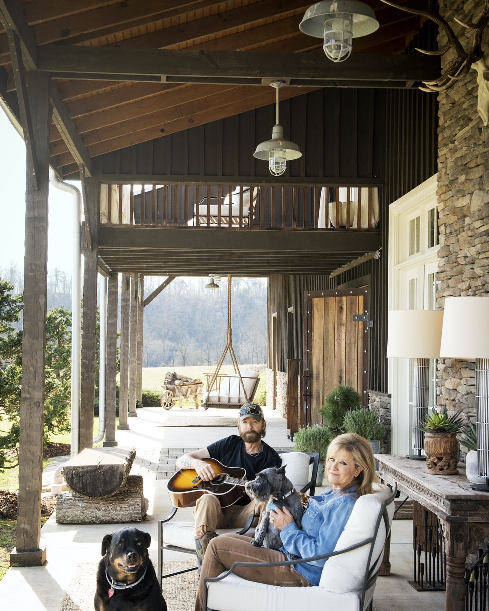 ronnie dunn and his wife, janine, relax on their porch