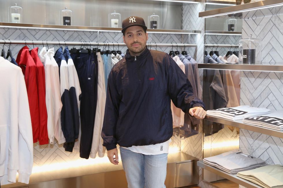 a man standing in a clothing store