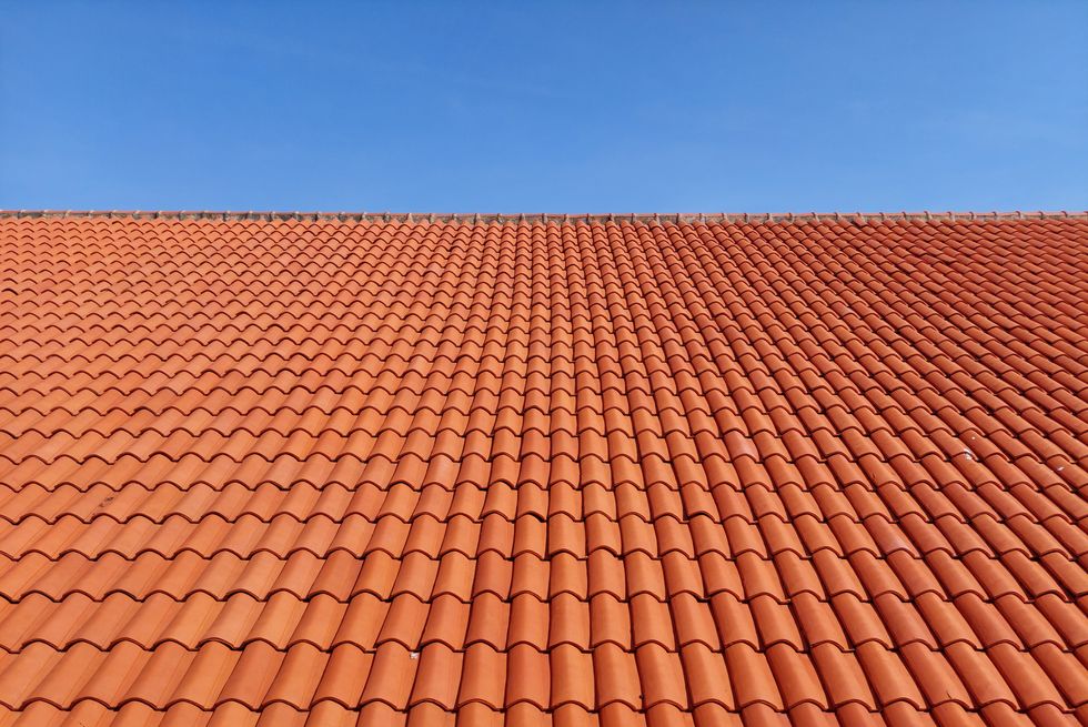 roof of building with clay tiles against clear sky