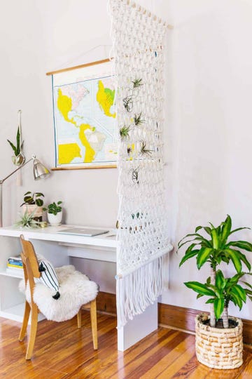 room divider ideas, a white table with a white chair and a white table with a plant