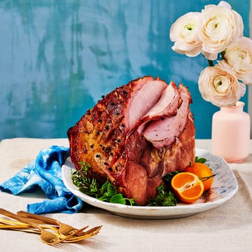 root beer glazed ham root beer glazed ham on a platter with utensils and a vase with flowers
