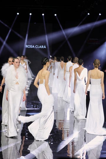 a group of people in white dresses